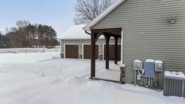 exterior space featuring a garage and central AC unit