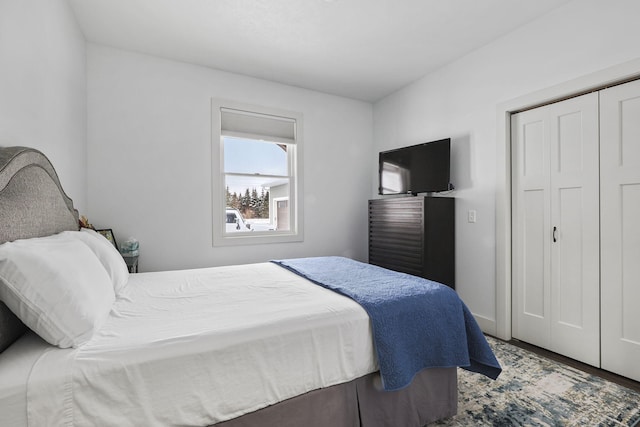 bedroom with a closet and wood finished floors