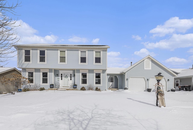 colonial home featuring an attached garage