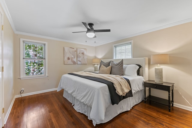 bedroom featuring dark wood-style floors, multiple windows, ornamental molding, and baseboards