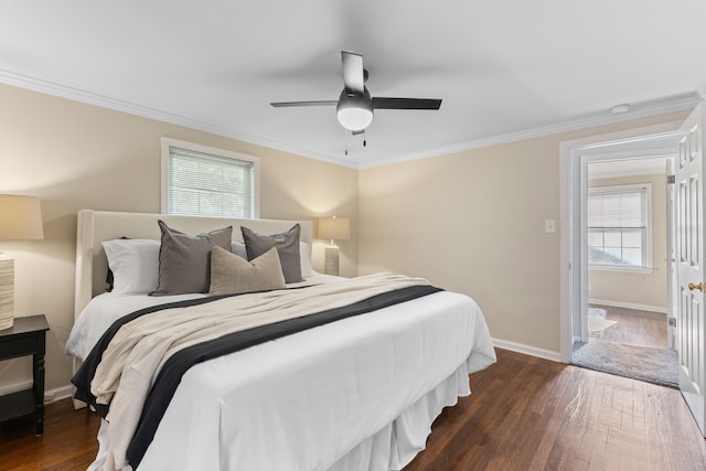 bedroom with dark wood-style flooring, crown molding, and baseboards