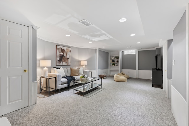 living room with recessed lighting, visible vents, carpet flooring, and wainscoting