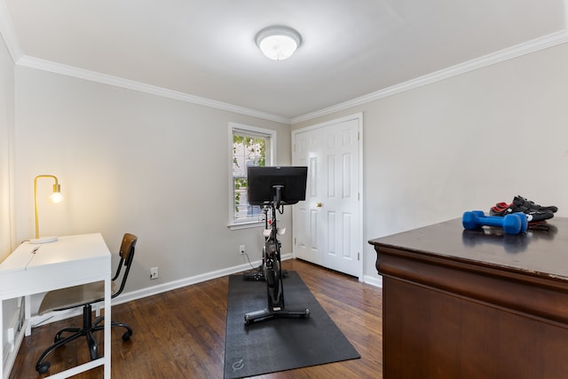 workout room with ornamental molding, dark wood finished floors, and baseboards