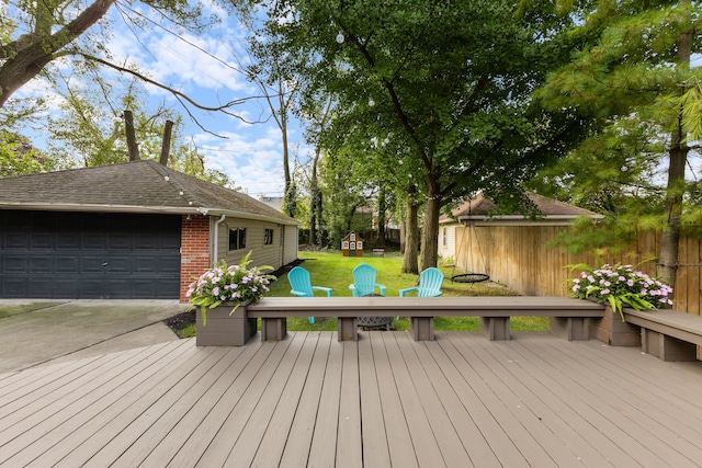 wooden terrace featuring a yard, a playground, fence, and an outdoor structure