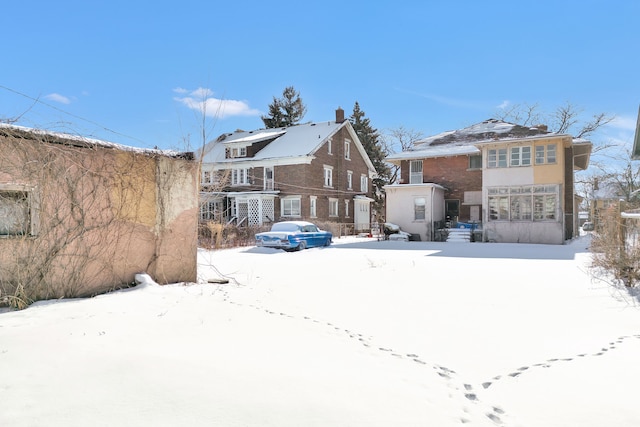 view of snow covered house