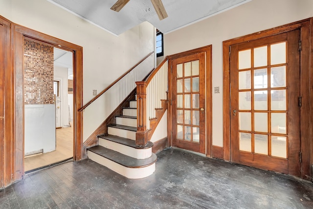 stairs with a ceiling fan