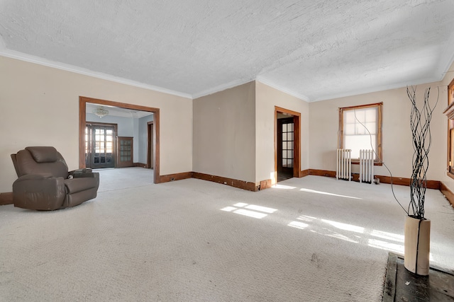 unfurnished living room featuring ornamental molding, carpet floors, and a textured ceiling