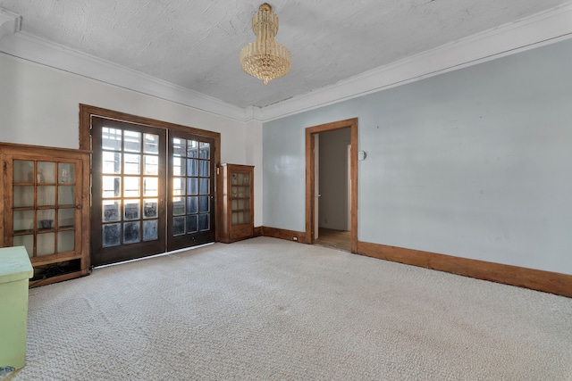 unfurnished room featuring french doors, crown molding, light carpet, a textured ceiling, and baseboards