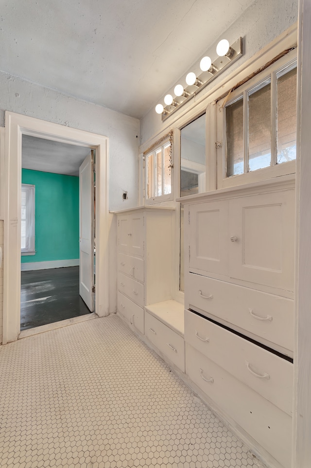 bathroom with baseboards