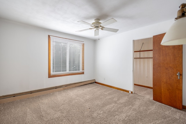 unfurnished room with a baseboard heating unit, light carpet, a ceiling fan, and baseboards