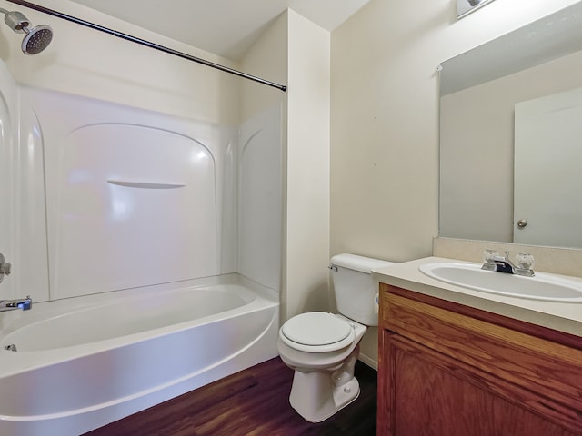 full bathroom featuring wood finished floors, vanity, toilet, and shower / bathtub combination