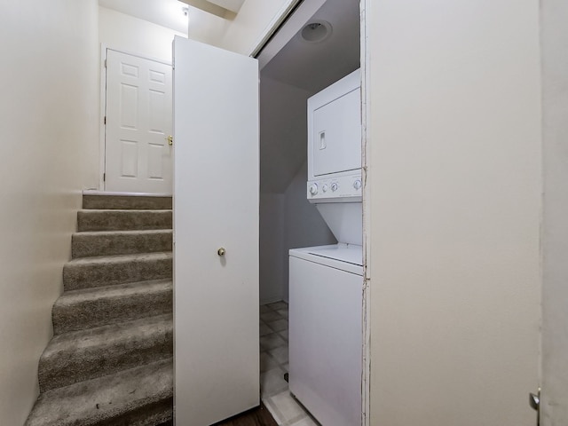 laundry area featuring laundry area and stacked washing maching and dryer