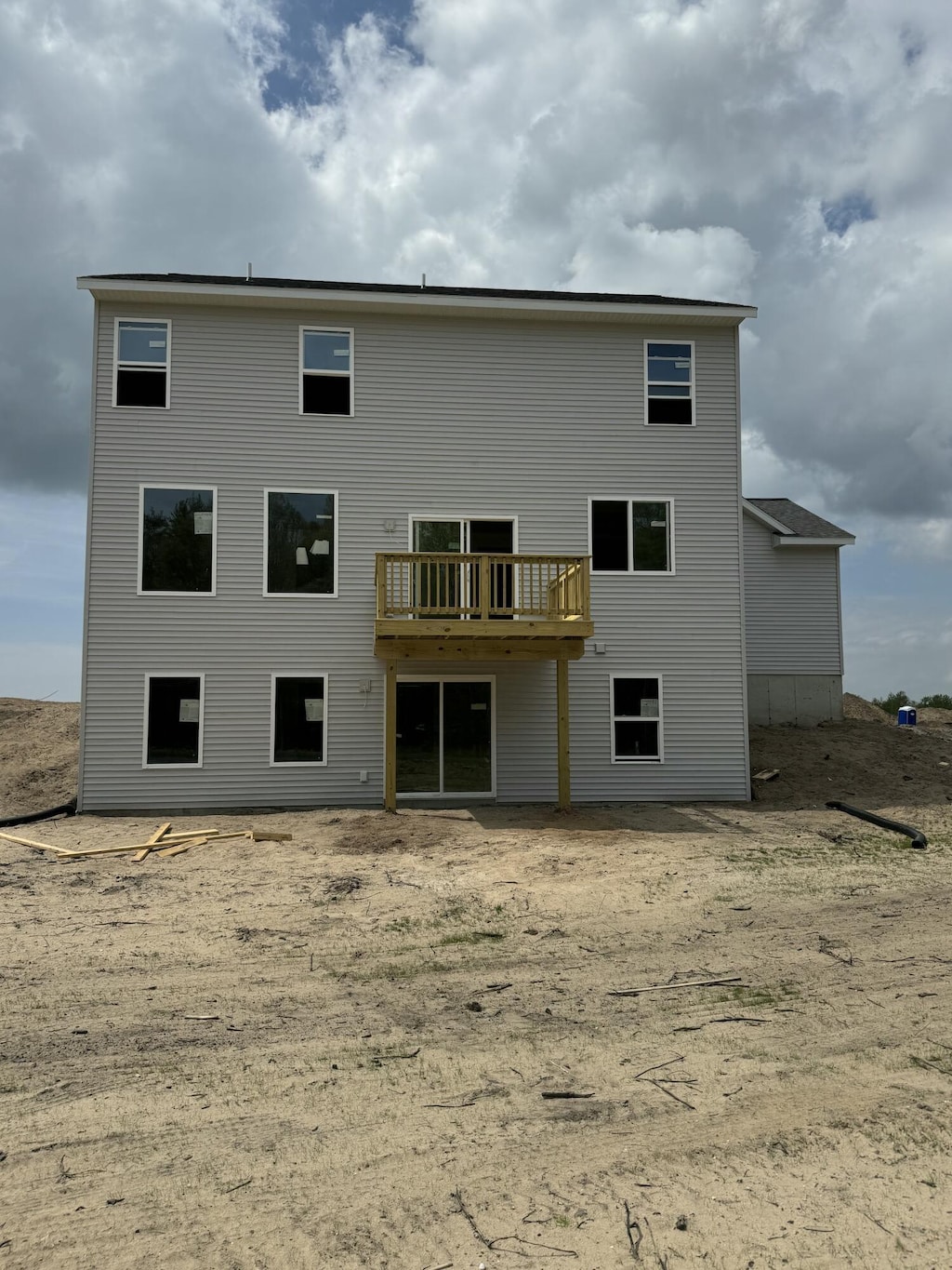 1973 Lowe Dr, Spring Lake, MI 49456 - rear view of house with a deck
