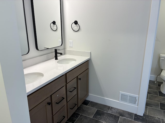 1973 Lowe Dr, Spring Lake, MI 49456 - full bath with toilet and double vanity