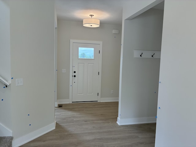 1973 Lowe Dr, Spring Lake, MI 49456 - entryway with wood finished floors and baseboards
