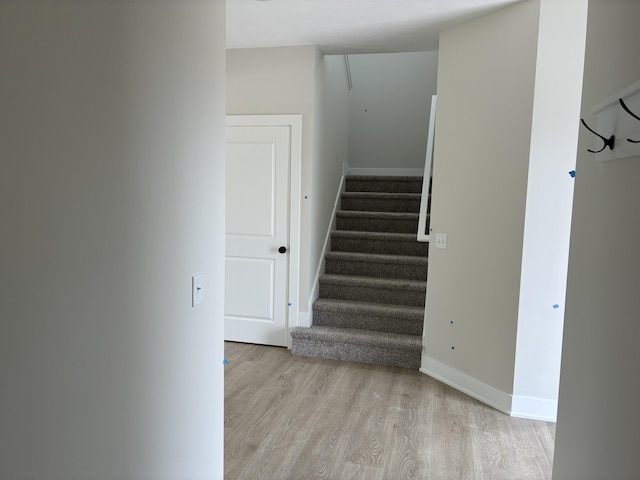 1973 Lowe Dr, Spring Lake, MI 49456 - staircase featuring wood finished floors and attic access