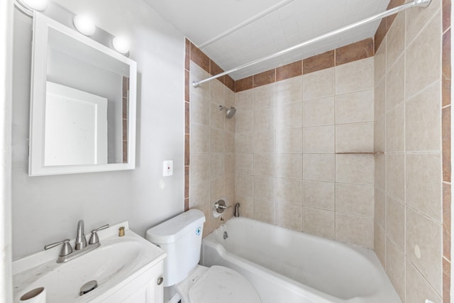 bathroom featuring  shower combination, vanity, and toilet