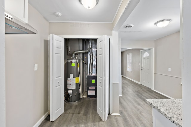 interior space featuring water heater and visible vents