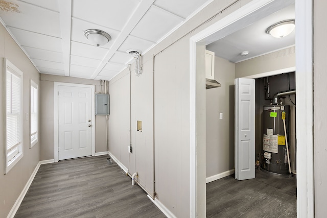 corridor featuring gas water heater, dark wood finished floors, visible vents, electric panel, and baseboards