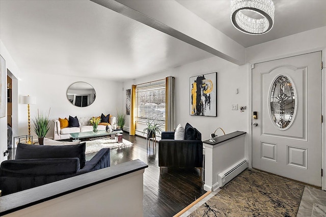 entryway with baseboards, a chandelier, baseboard heating, and wood finished floors