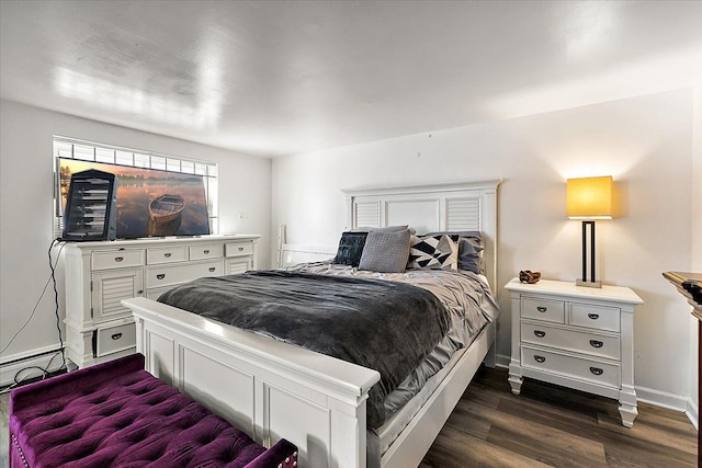 bedroom with dark wood-style floors and baseboards