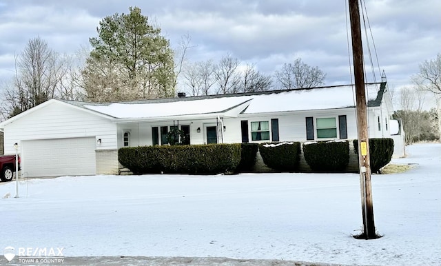 single story home with a garage and brick siding