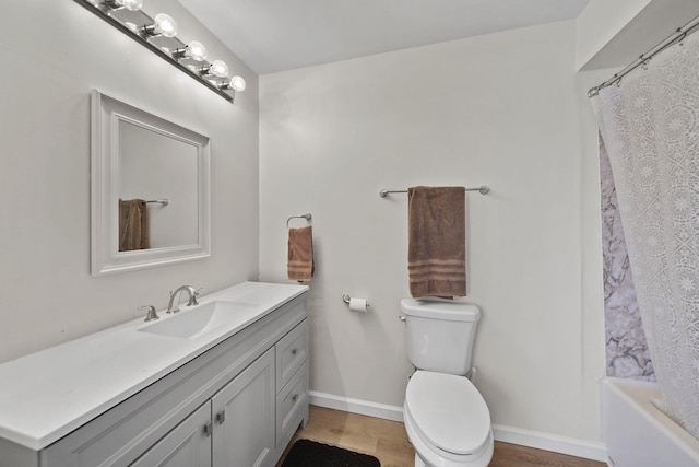 full bathroom with shower / bath combo, baseboards, toilet, wood finished floors, and vanity