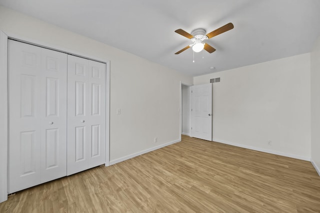 unfurnished bedroom with light wood-type flooring, visible vents, and baseboards