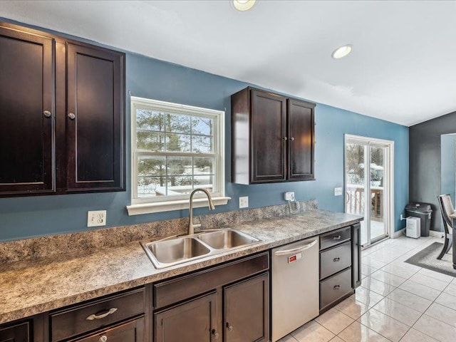 kitchen with light tile patterned floors, recessed lighting, a sink, dark brown cabinets, and dishwasher