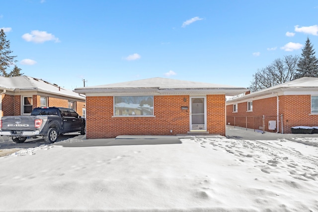 view of front of house featuring brick siding