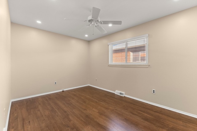 spare room featuring baseboards, visible vents, ceiling fan, dark wood-style flooring, and recessed lighting