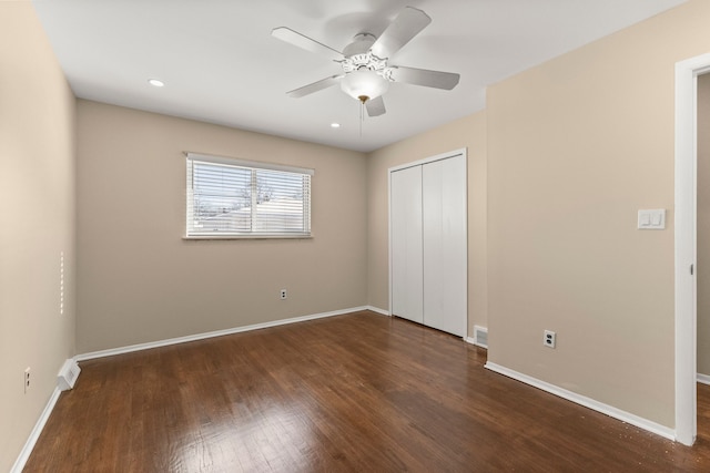 unfurnished bedroom featuring recessed lighting, a ceiling fan, baseboards, a closet, and dark wood finished floors