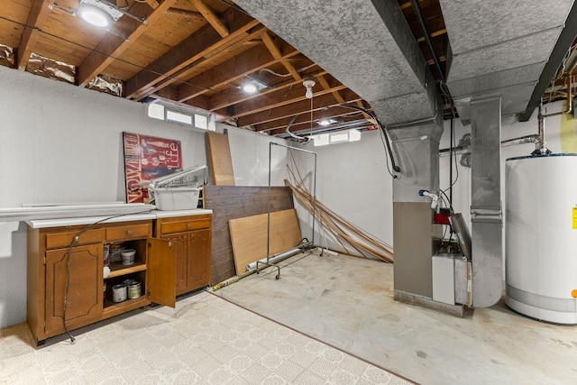 basement with gas water heater and plenty of natural light