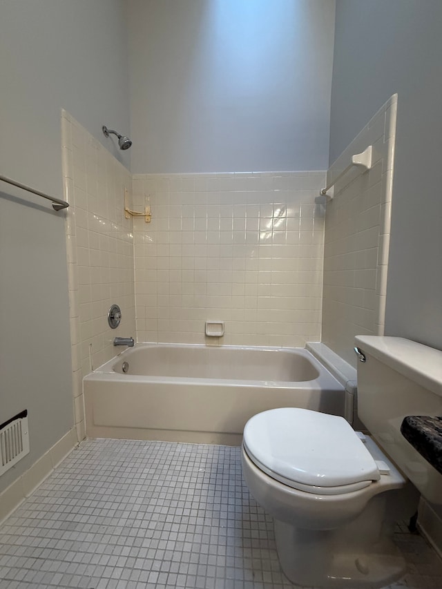 full bath with shower / bath combination, visible vents, toilet, and tile patterned floors