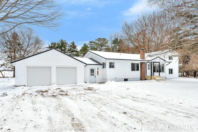 view of front of home featuring a garage and a chimney