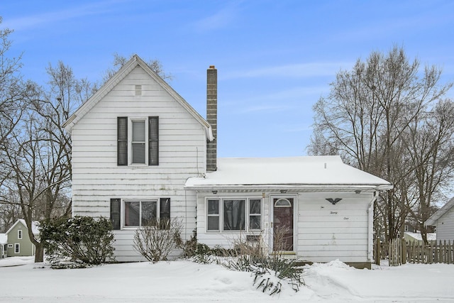 traditional home featuring a chimney