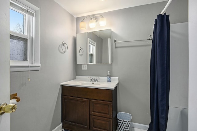 bathroom with vanity and baseboards