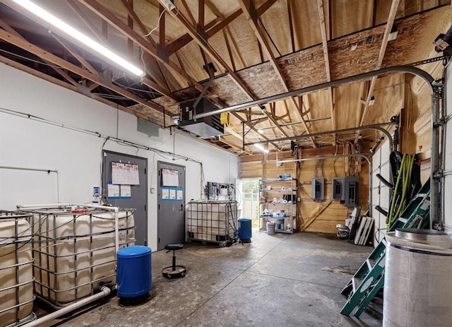 basement featuring a garage and electric panel