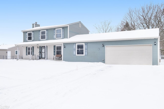 view of front facade featuring a garage, a chimney, and a porch