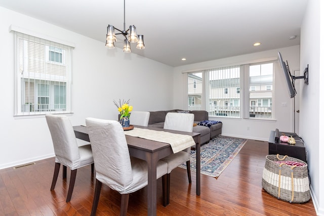 dining room with dark wood-style floors, baseboards, visible vents, and recessed lighting