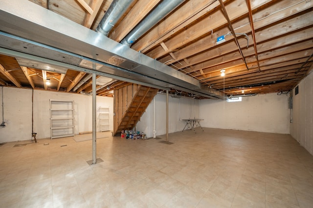 basement featuring stairs