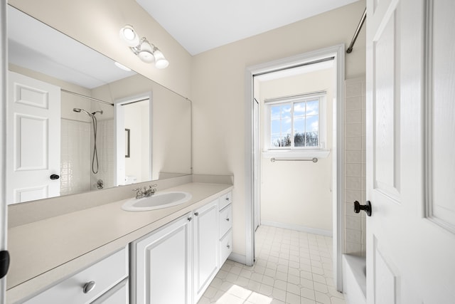 bathroom with vanity and baseboards