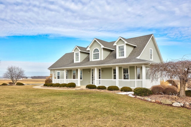 cape cod home with a porch, roof with shingles, and a front yard