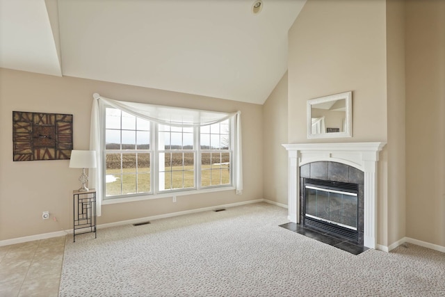 unfurnished living room featuring visible vents, a fireplace, and baseboards