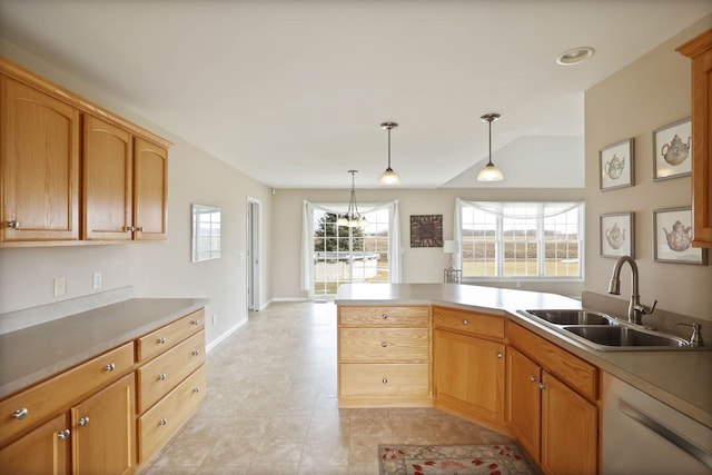 kitchen with lofted ceiling, hanging light fixtures, a peninsula, white dishwasher, and a sink