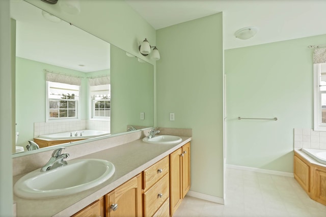 full bath featuring a bath, double vanity, baseboards, and a sink