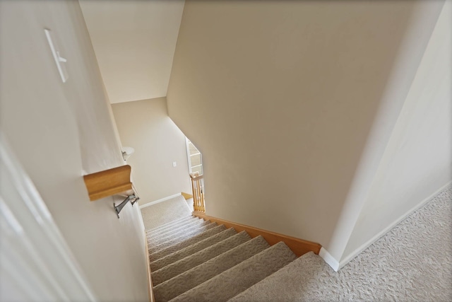 staircase with carpet flooring and baseboards