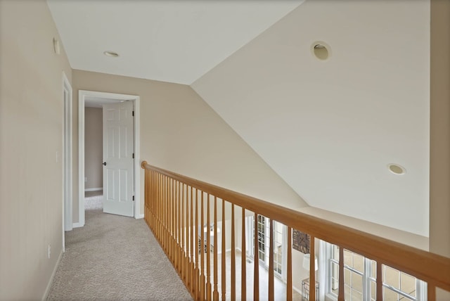 hall with carpet flooring and baseboards