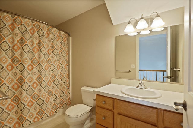 bathroom featuring toilet, curtained shower, and vanity