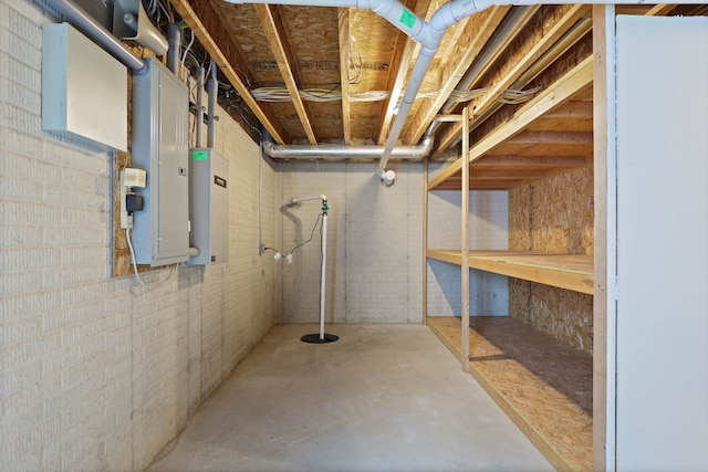 unfinished basement featuring brick wall